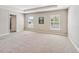 Bright bedroom featuring neutral walls, carpeted floors, and ample natural light at 5996 Wildflower Field Way, St Cloud, FL 34771