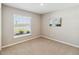 Neutral bedroom with a bright window and carpeted floor for a cozy atmosphere at 5996 Wildflower Field Way, St Cloud, FL 34771