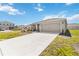 Charming home with a two-car garage and well-maintained landscaping at 5996 Wildflower Field Way, St Cloud, FL 34771