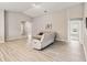 Spacious living room with modern flooring, neutral walls, and lots of natural light at 5996 Wildflower Field Way, St Cloud, FL 34771