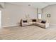 Open concept living room with vaulted ceilings, modern flooring, and neutral wall color at 5996 Wildflower Field Way, St Cloud, FL 34771