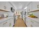Modern kitchen design with stainless steel appliances, white cabinets, and sleek countertops at 6373 Forecastle Ct, Orlando, FL 32807
