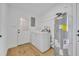 Functional laundry room with washer, dryer, and water heater at 6373 Forecastle Ct, Orlando, FL 32807