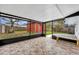 Enclosed patio with tiled floor and view of backyard shed at 6373 Forecastle Ct, Orlando, FL 32807