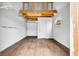 Interior of a shed with wood floor, white walls, and a ladder to storage at 6373 Forecastle Ct, Orlando, FL 32807