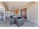 Covered back porch with outdoor seating at 68 Herring Ct, Kissimmee, FL 34759