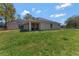 Backyard view with a covered porch at 68 Herring Ct, Kissimmee, FL 34759