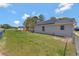 Spacious backyard with a grass lawn and fence at 68 Herring Ct, Kissimmee, FL 34759