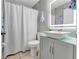 Stylish bathroom with modern vanity, vessel sink, decorative mirror, and shower-tub combination at 68 Herring Ct, Kissimmee, FL 34759