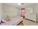 Cozy bedroom with natural light, tiled flooring, closet, and neutral colors at 68 Herring Ct, Kissimmee, FL 34759