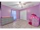 Childs bedroom painted purple with tile, large closet and window at 68 Herring Ct, Kissimmee, FL 34759