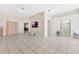 Spacious living area with tiled flooring, neutral paint, and a seamless open design at 68 Herring Ct, Kissimmee, FL 34759