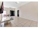 Spacious living area with tiled flooring, neutral paint, and a seamless open design at 68 Herring Ct, Kissimmee, FL 34759