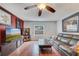 Cozy living room featuring hardwood floors, a ceiling fan and natural light from the window at 7466 Canford Ct # 25, Winter Park, FL 32792