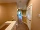 Hallway with neutral paint and carpet flooring and white trim at 7534 Brooklyn Dr, Kissimmee, FL 34747