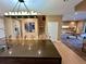 Kitchen with modern island open to living area at 7534 Brooklyn Dr, Kissimmee, FL 34747