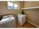 Functional laundry room with a front-load washer and dryer, enhancing convenience at 7534 Brooklyn Dr, Kissimmee, FL 34747