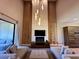 Living room with floor to ceiling fireplace and recessed lighting at 7534 Brooklyn Dr, Kissimmee, FL 34747