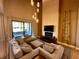 Living room with fireplace, tile accent wall and outdoor access at 7534 Brooklyn Dr, Kissimmee, FL 34747