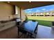Outdoor kitchen and seating area for relaxing and entertaining at 7534 Brooklyn Dr, Kissimmee, FL 34747