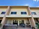Rear exterior view of multi-story home with outdoor patio and grill area at 7534 Brooklyn Dr, Kissimmee, FL 34747