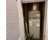 Utility closet with HVAC unit and louvered door at 7534 Brooklyn Dr, Kissimmee, FL 34747