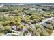 Community aerial view featuring homes with mature trees, a pond, and nearby highway access at 8176 Emerald Forest Ct, Sanford, FL 32771