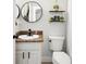 Small bathroom features updated fixtures, decor and a toilet at 8176 Emerald Forest Ct, Sanford, FL 32771