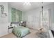 Charming bedroom with stylish decor including hanging chair and ivy accents at 8176 Emerald Forest Ct, Sanford, FL 32771