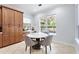 Cozy breakfast nook with pool view, adjacent to built-in cabinets and a desk area at 8176 Emerald Forest Ct, Sanford, FL 32771