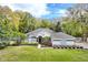 Charming single-story home with manicured lawn, mature trees, and inviting curb appeal during daytime at 8176 Emerald Forest Ct, Sanford, FL 32771
