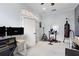 Home gym featuring workout equipment, desk, and good lighting at 8176 Emerald Forest Ct, Sanford, FL 32771