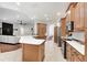 Open kitchen with stainless steel appliances, ample cabinet space, and a view to the living room at 8176 Emerald Forest Ct, Sanford, FL 32771