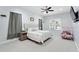 Serene main bedroom with neutral decor, plush carpeting, and natural light at 8176 Emerald Forest Ct, Sanford, FL 32771