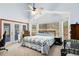 The bedroom has carpeted floors, white walls, and lots of natural light with a ceiling fan at 835 Longleaf Pine Ct, Orlando, FL 32825