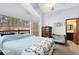 The bedroom has carpeted floors, white walls, and lots of natural light with a ceiling fan at 835 Longleaf Pine Ct, Orlando, FL 32825