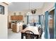 Dining area with a light fixture and sliding glass doors overlooking the backyard, perfect for Gathering meals at 835 Longleaf Pine Ct, Orlando, FL 32825