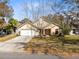 Charming single-Gathering home features a well-manicured lawn, two car garage and mature landscaping at 835 Longleaf Pine Ct, Orlando, FL 32825
