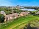 Aerial view of complex with lush green lawns and lake views at 8837 Latrec Ave # 5307, Orlando, FL 32819