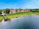 Beautiful lakefront property with a wooden dock and stunning water views at 8837 Latrec Ave # 5307, Orlando, FL 32819