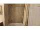Bathroom with tile surround tub, shower head, and vanity at 8837 Latrec Ave # 5307, Orlando, FL 32819