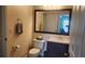 Cozy bathroom featuring a sleek vanity, framed mirror, toilet, and modern fixtures at 8837 Latrec Ave # 5307, Orlando, FL 32819