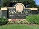 Attractive Sand Lake Private Residences sign with manicured landscaping at 8837 Latrec Ave # 5307, Orlando, FL 32819