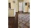 Living room area featuring hardwood floors and access to other rooms at 8837 Latrec Ave # 5307, Orlando, FL 32819