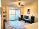 Bright living room featuring a sliding glass door to a balcony at 8837 Latrec Ave # 5307, Orlando, FL 32819