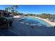 Inviting community pool with ample seating and shaded areas at 8837 Latrec Ave # 5307, Orlando, FL 32819