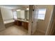Bright bathroom with double vanity, soaking tub, and tiled floor at 8991 Cuban Palm Rd, Kissimmee, FL 34747