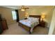 Comfortable bedroom featuring a ceiling fan and natural light at 8991 Cuban Palm Rd, Kissimmee, FL 34747