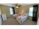 Bedroom with two twin beds and a window with black drapes at 8991 Cuban Palm Rd, Kissimmee, FL 34747