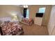 Twin bedroom with neutral colored walls and carpet at 8991 Cuban Palm Rd, Kissimmee, FL 34747